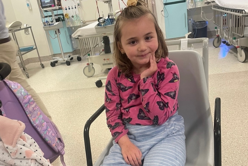 Strep A patient Asi sitting in a chair in hospital